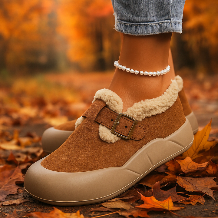Deep Black Alira buckle clogs. Sleek women's slip-on footwear, comfortable and cozy for everyday style.