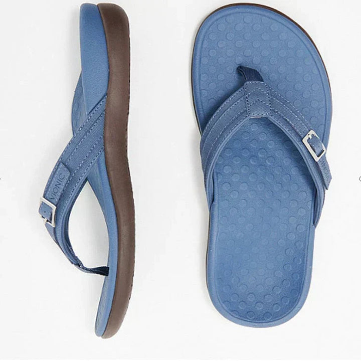 Woman wearing comfortable orthopedic arch support sandals for a relaxed summer day walk.