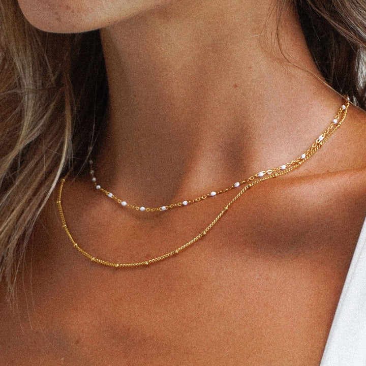 Women's Amara double bead choker necklace, elegant and adjustable jewelry accessory.