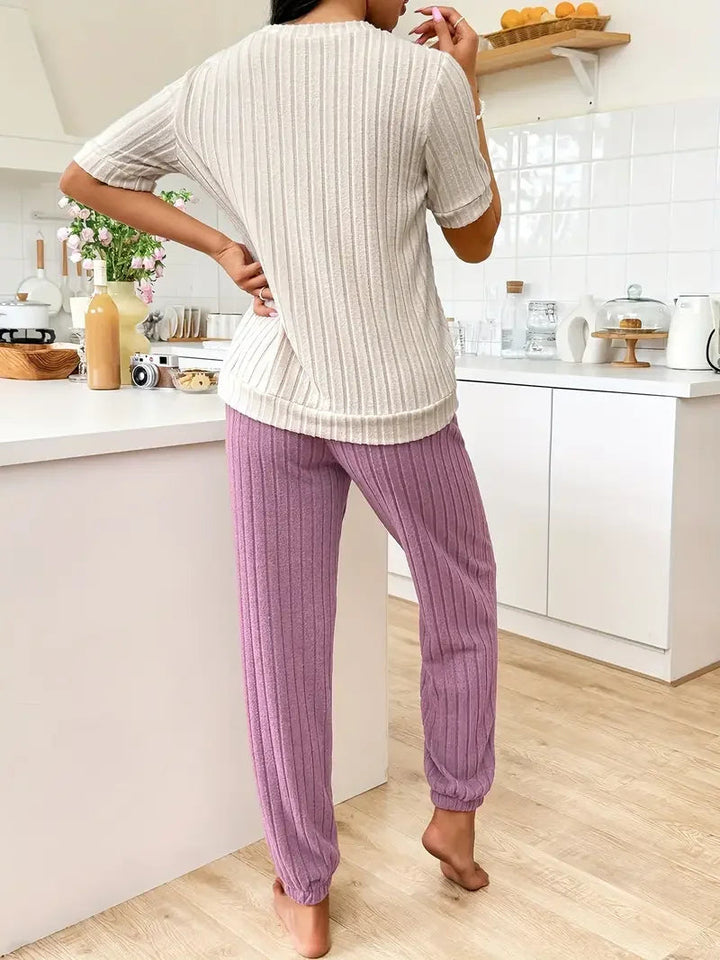 Cozy women's two-piece ribbed loungewear set featuring a sweet heart design & relaxed fit.