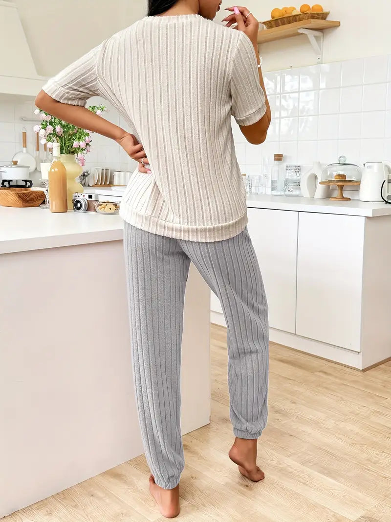 Stylish women's ribbed two-piece set, featuring a cozy heart design, ideal for relaxed home comfort.