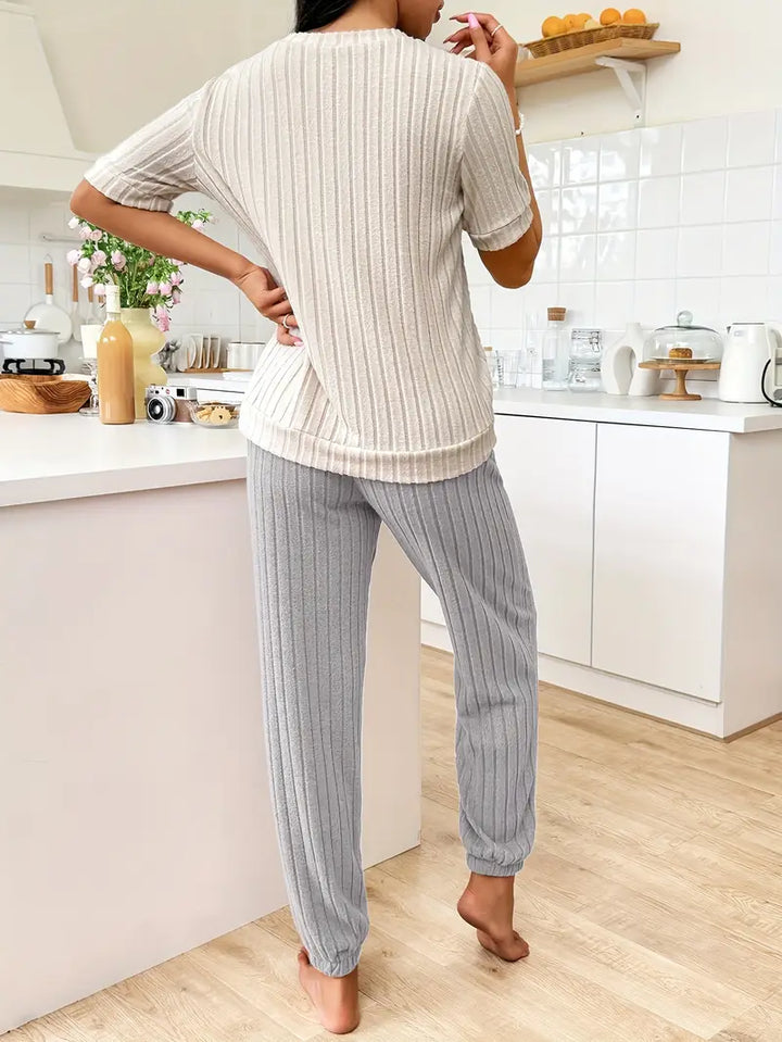 Stylish women's ribbed two-piece set, featuring a cozy heart design, ideal for relaxed home comfort.