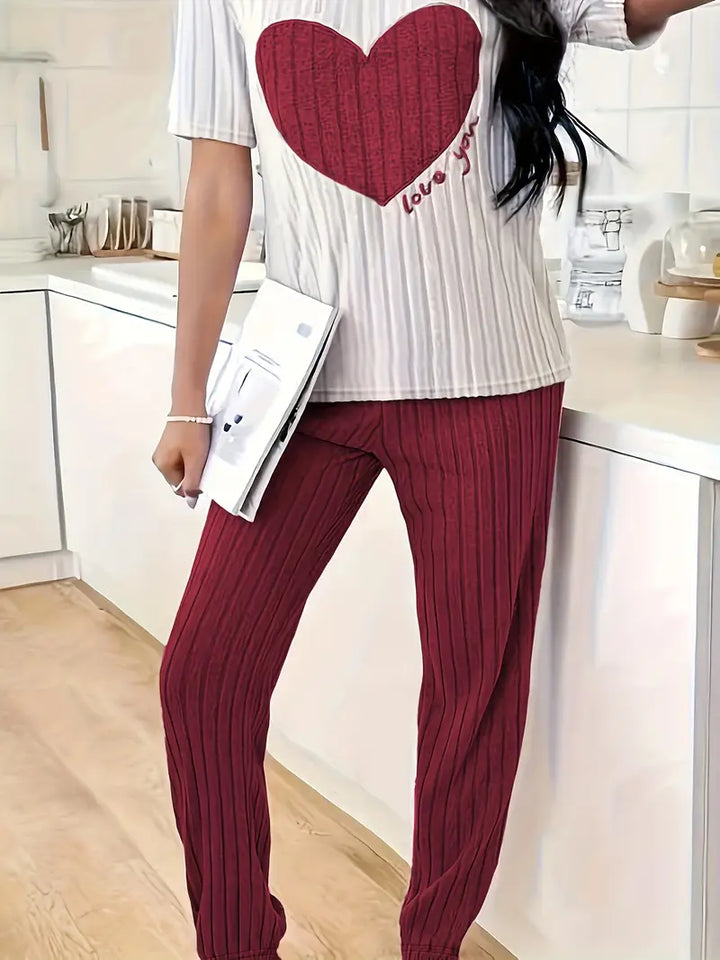 Elegant women's two-piece ribbed loungewear featuring a cozy heart design, perfect for home wear.