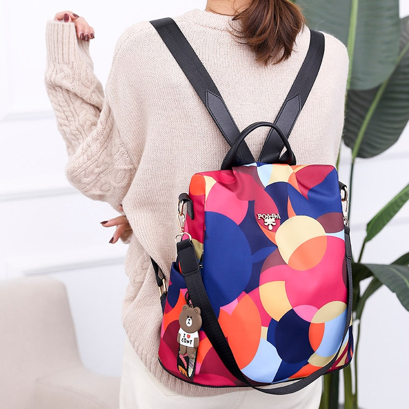 Women's anti-theft backpack, water-resistant PU leather, multiple pockets for daily use & travel safety.