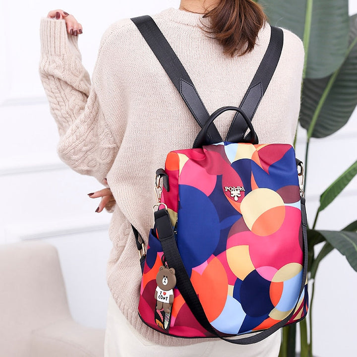 Women's anti-theft backpack, water-resistant PU leather, multiple pockets for daily use & travel safety.