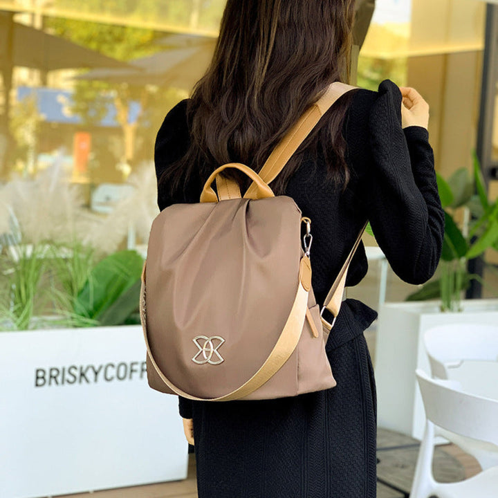 Stylish women's anti-theft backpack purse, convertible shoulder bag for daily use, secure laptop & travel essentials.