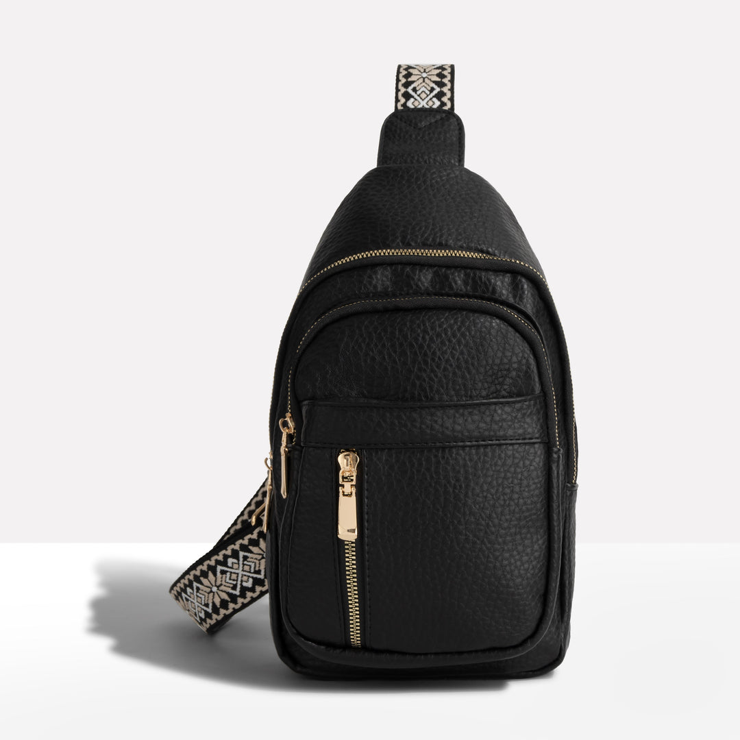 Women's anti-theft sling backpack with decorative strap, perfect for travel & secure everyday carry.