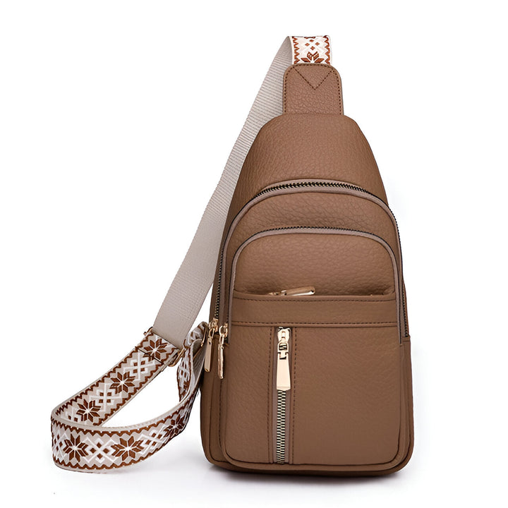 Fashionable women's anti-theft sling backpack featuring a decorative strap & secure compartments for travel.
