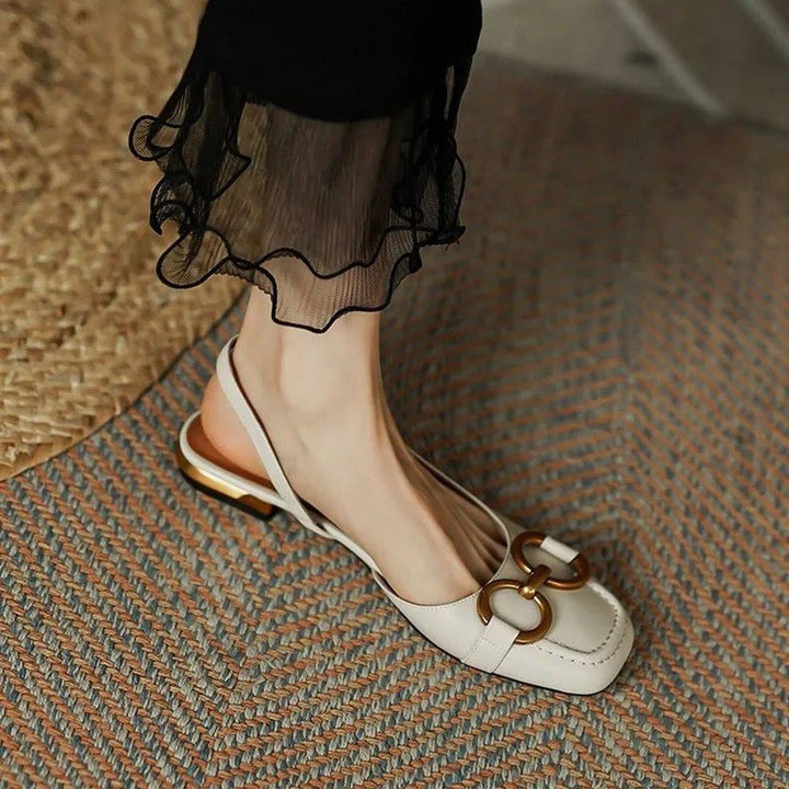 Black women's everyday slingback flats, stable low heel ensuring long-lasting comfort and chic appeal.