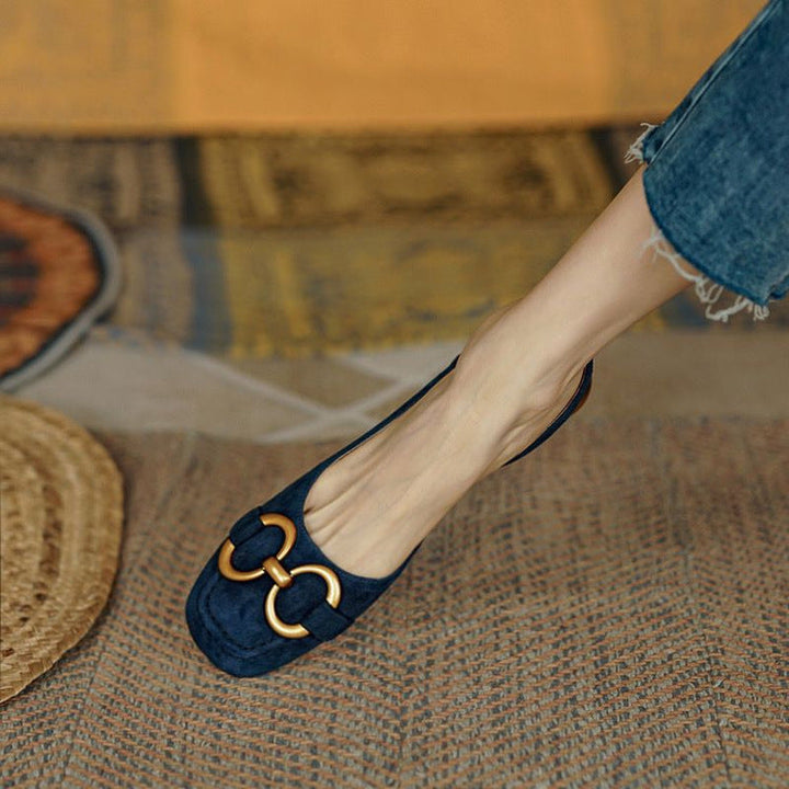 Stylish blue women's slingback flats, featuring a comfortable stable low heel for all-day elegance.