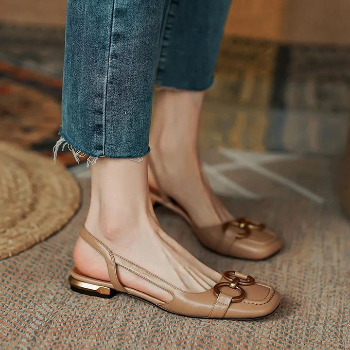 Comfortable women's apricot slingback flats, designed with a stable low heel for ease and style.
