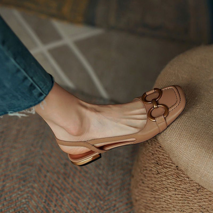 Versatile black women's slingback flats, providing exceptional comfort and a stable low heel.