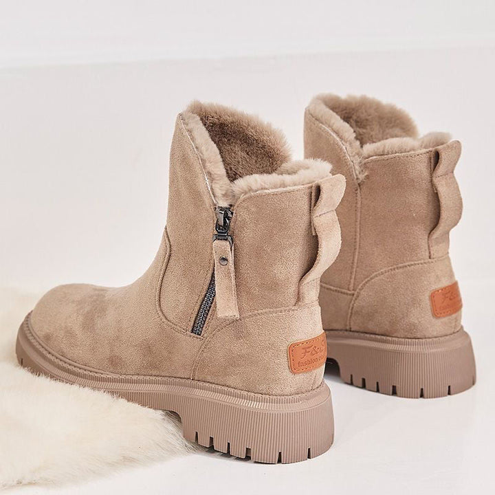 Close-up of a women's warm winter boot in apricot, showing cozy lining and waterproof design.