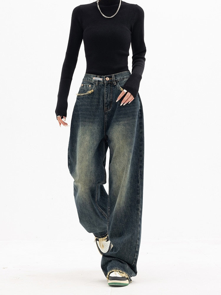 Close-up of women's Aria style high-waist baggy jeans, showcasing the blue-gray wash and relaxed fit.