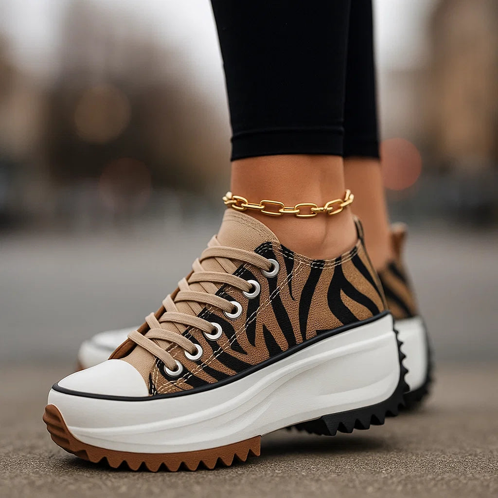 Women's Arlina Rise platform sneakers with black & white tiger print, lace-up design, and orthopedic comfort.