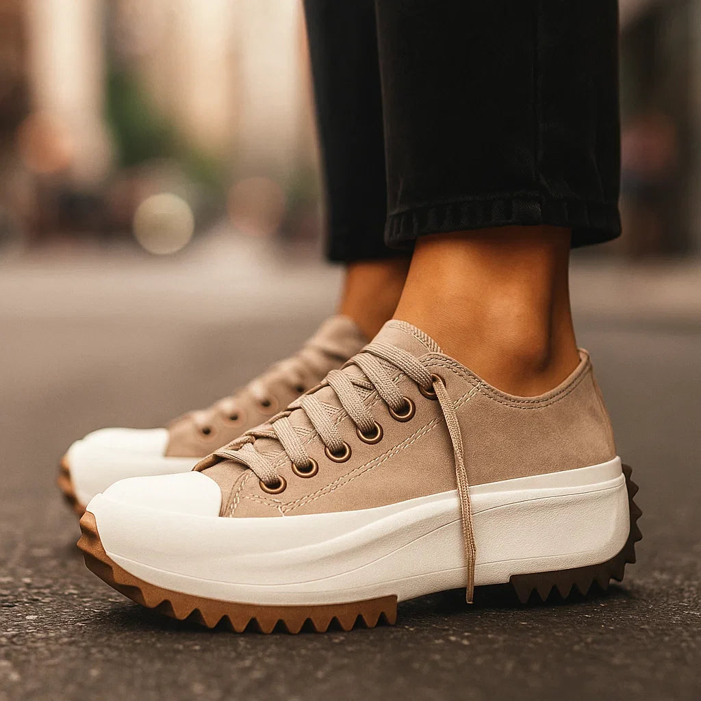 Fashionable Arlina Rise platform sneakers for women, featuring a striking tan tiger print, shock-absorbing sole, and laces.