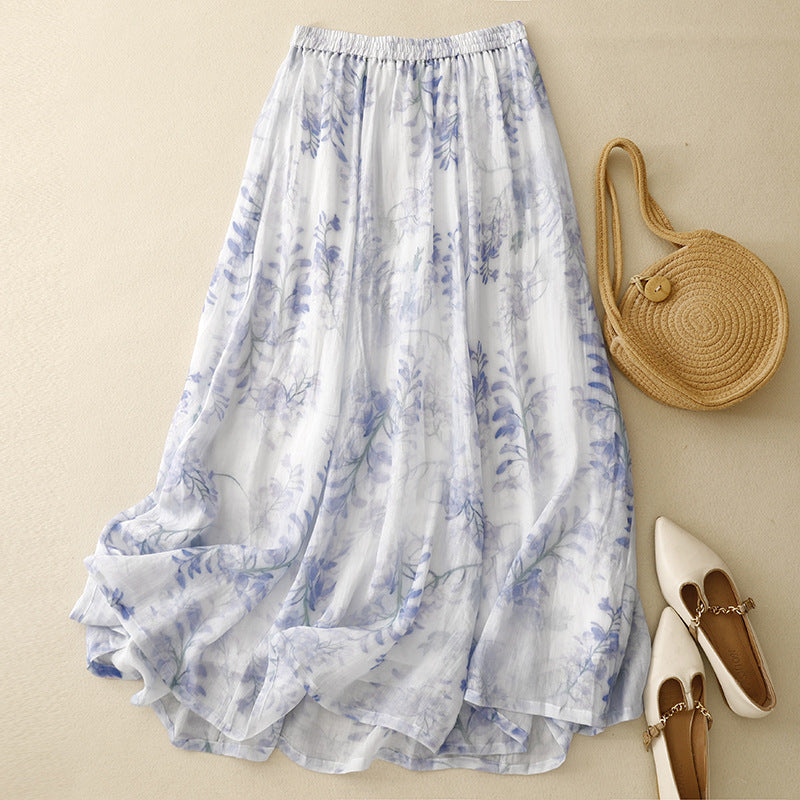 Women's artistic flowy maxi skirt with a vibrant abstract print & comfortable drawstring waist, perfect for summer boho style.
