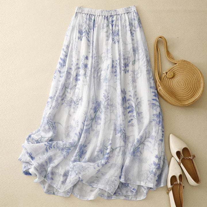 Women's artistic flowy maxi skirt with a vibrant abstract print & comfortable drawstring waist, perfect for summer boho style.