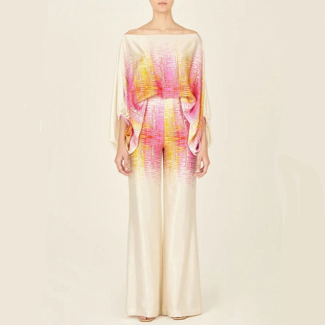 Fashionable women's artistic print one-shoulder top and high-waist wide-leg pants set. Perfect for summer style.