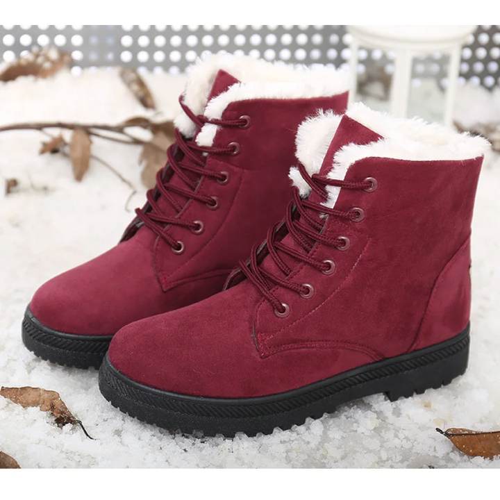 Women's Aspen lace-up snow boots with rugged non-slip sole, perfect for icy and cold conditions.