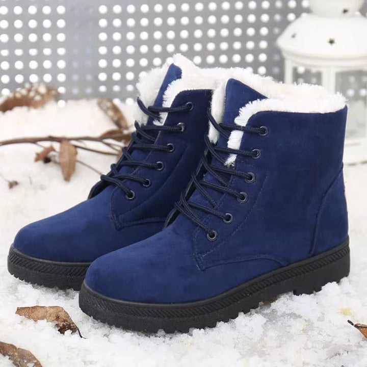 High-top Women's Aspen winter boots, providing excellent ankle support and plush warmth in snow.