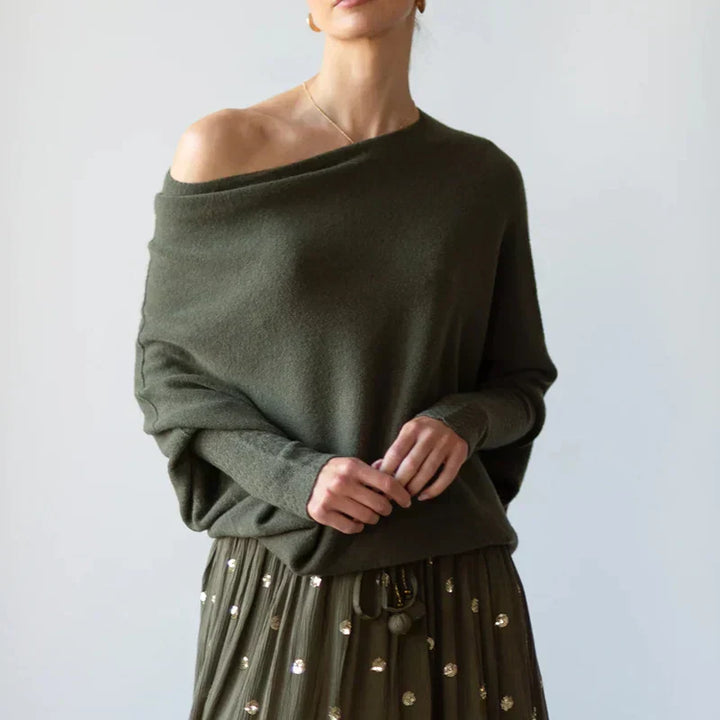 Comfortable women's asymmetric oversized sweater, a chic winter top with a unique design.