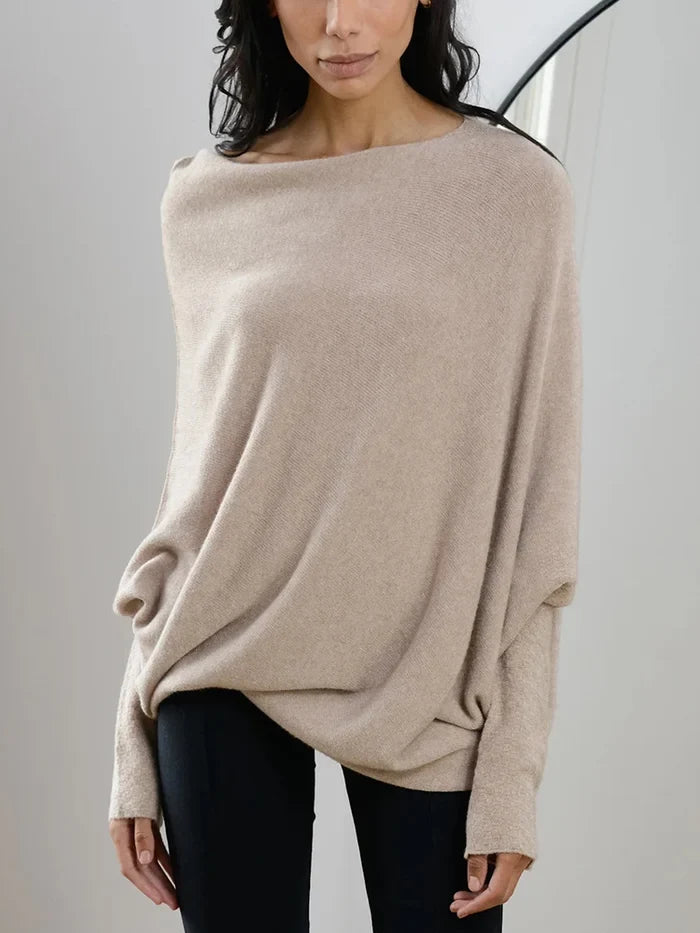 Fashionable women's asymmetric oversized sweater, a cozy everyday top for comfort and style.