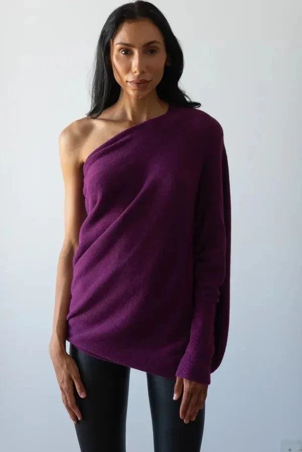 Warm & comfortable women's asymmetric oversized sweater, a versatile winter top with a modern look.