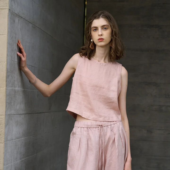 Women's asymmetric sleeveless crop top with crew neck, perfect for summer casual wear.
