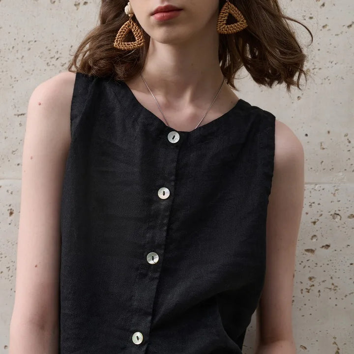 Modern asymmetric hem women's crop top, sleeveless, crew neck, suitable for stylish summer looks.