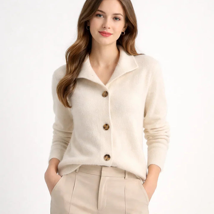 Full view of a women's asymmetrical knit cardigan, combining a relaxed fit with a chic button-up style.