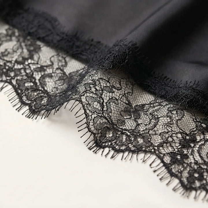 Relaxed fit women's asymmetrical top with sophisticated sheer details. Ideal for fashion-forward evening wear.