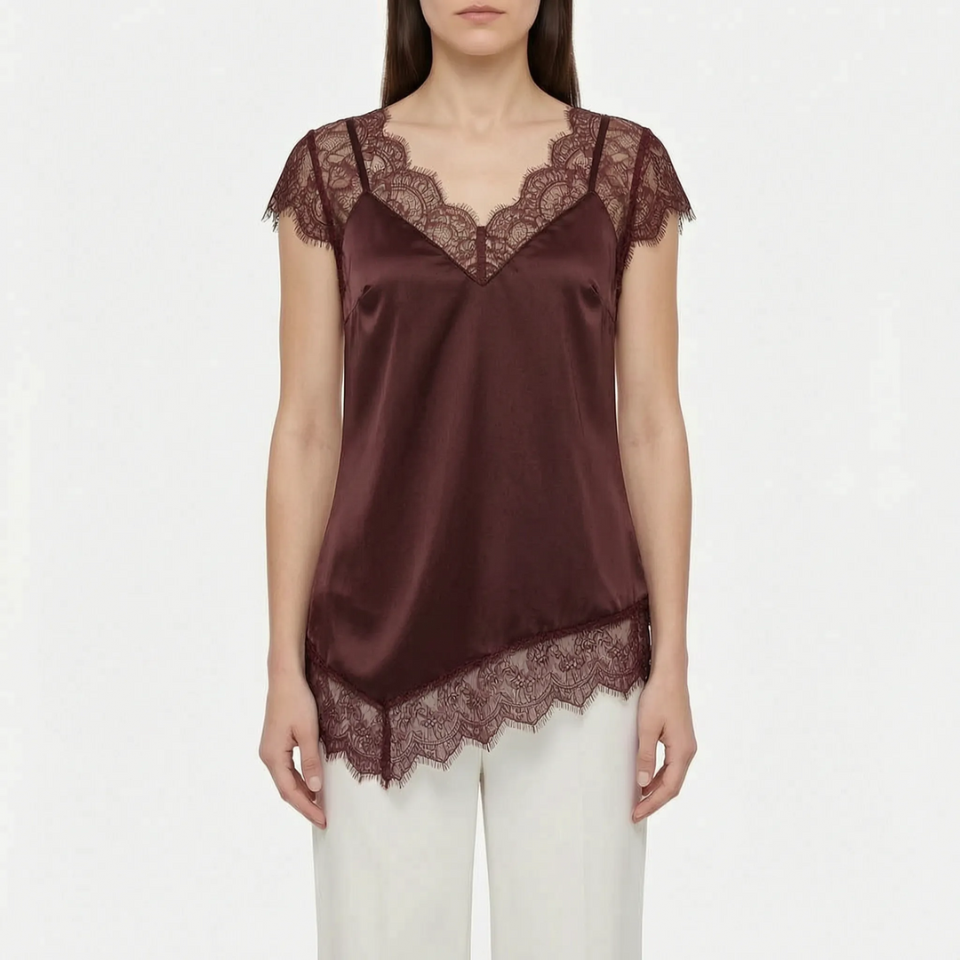 Elegant women's blouse, an asymmetrical top with sheer accents. Versatile for casual chic or sophisticated evening.