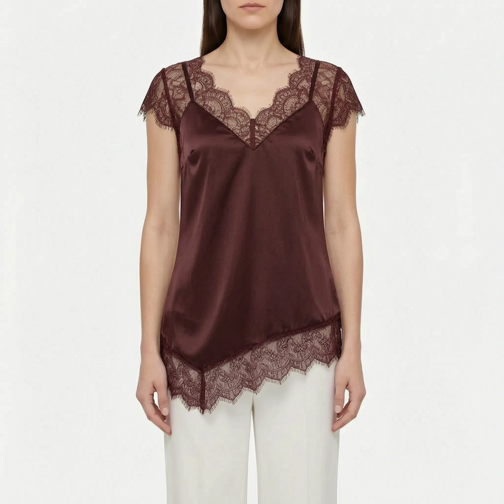 Elegant women's blouse, an asymmetrical top with sheer accents. Versatile for casual chic or sophisticated evening.
