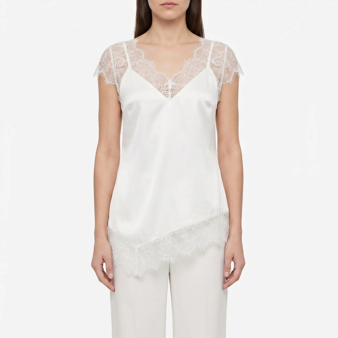 Stylish asymmetrical blouse for women, boasting sheer panels & a flattering deep V-back. Modern and chic.