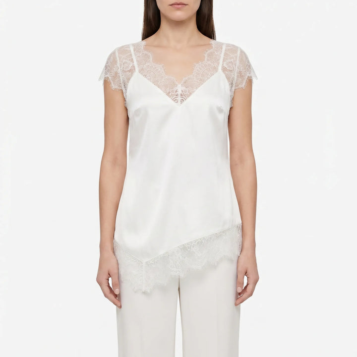 Stylish asymmetrical blouse for women, boasting sheer panels & a flattering deep V-back. Modern and chic.