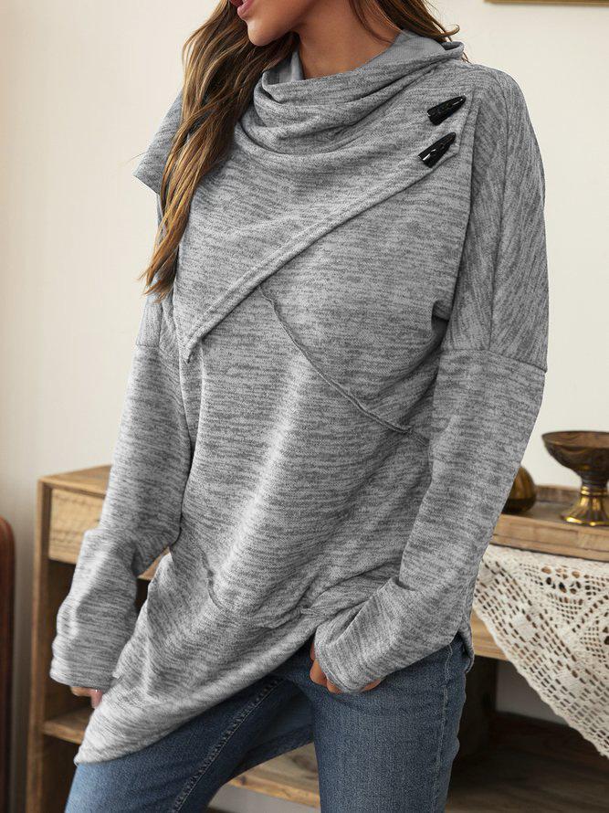 Fashionable women's asymmetrical top with a dramatic waterfall collar. Elegant flowy long sleeve shirt for modern style.