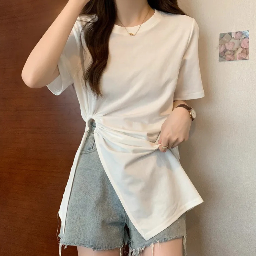 Chic black asymmetrical knit top for women, offering a modern style and comfortable fit.