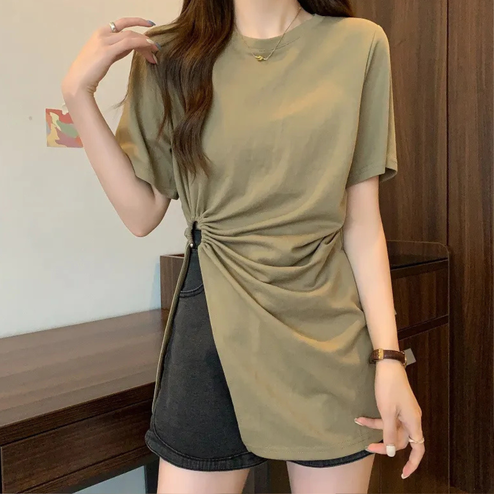 Stylish women's green asymmetrical knit top, a modern fashion statement for any occasion.
