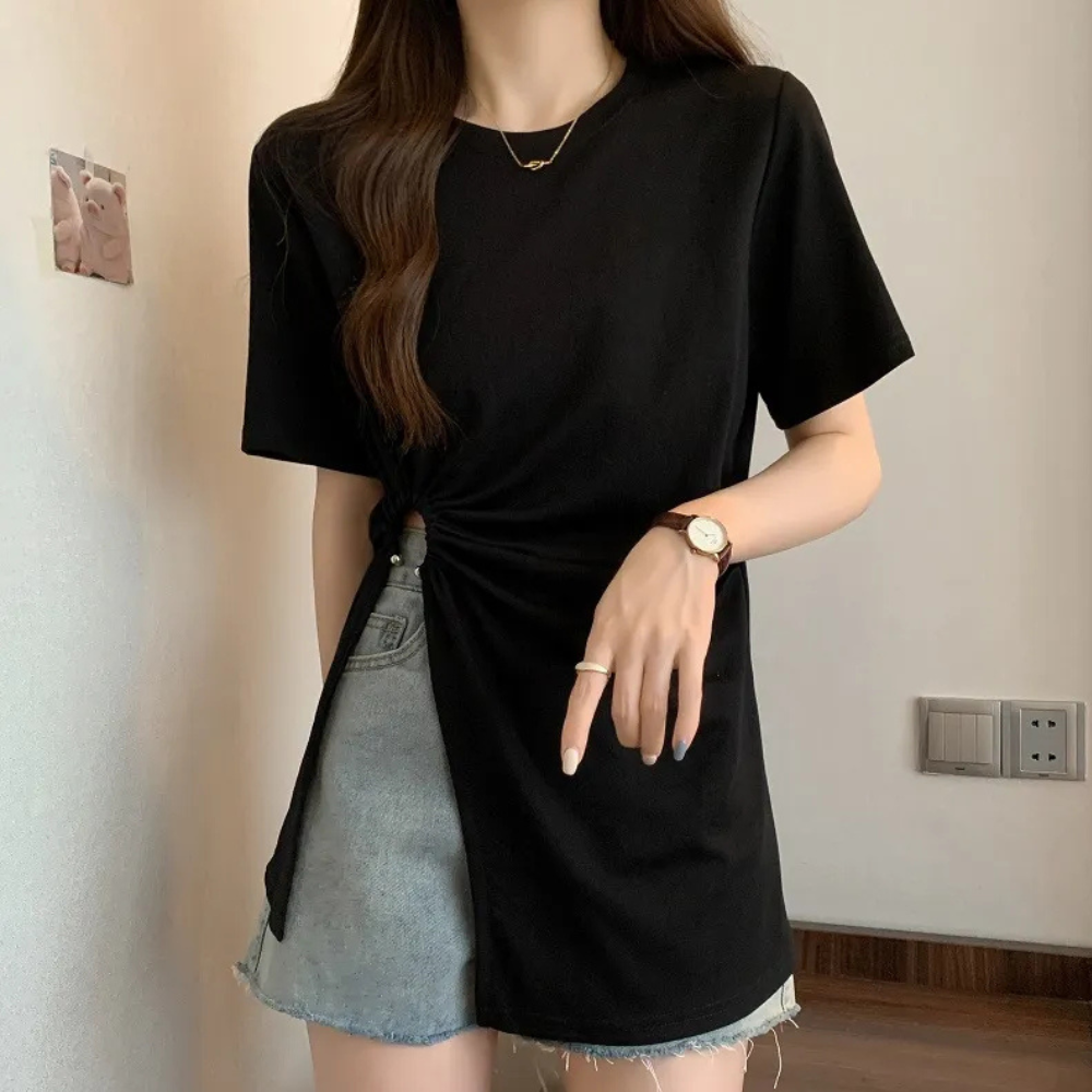 Sophisticated white asymmetrical knit top for women, blending modern chic with comfort.