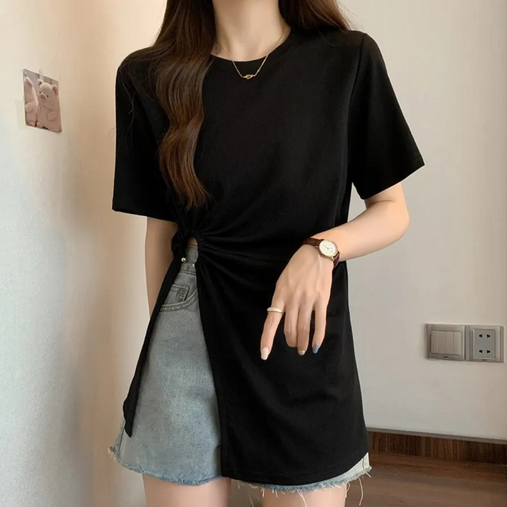 Sophisticated white asymmetrical knit top for women, blending modern chic with comfort.