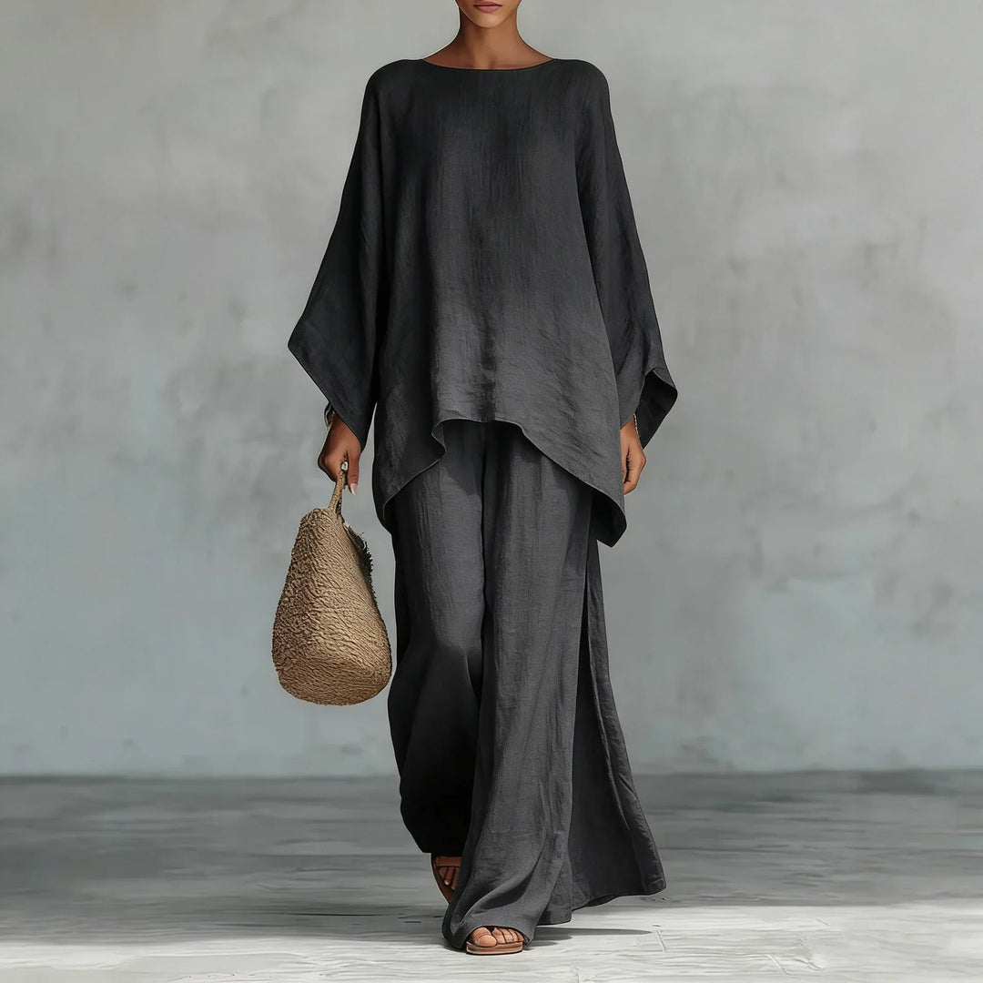 Comfortable women's two-piece set with an asymmetrical top & wide-leg pants. Ideal for travel or stylish casual wear.