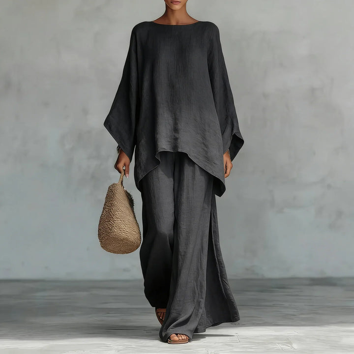 Comfortable women's two-piece set with an asymmetrical top & wide-leg pants. Ideal for travel or stylish casual wear.