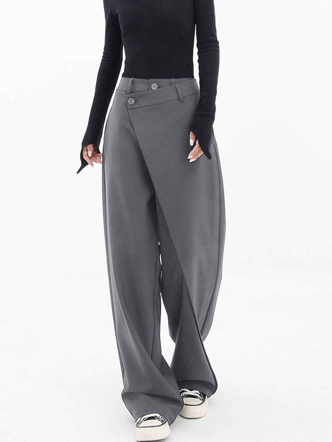 Women's black asymmetrical wide leg comfort pants. Loose fit for stylish casual wear and easy movement.