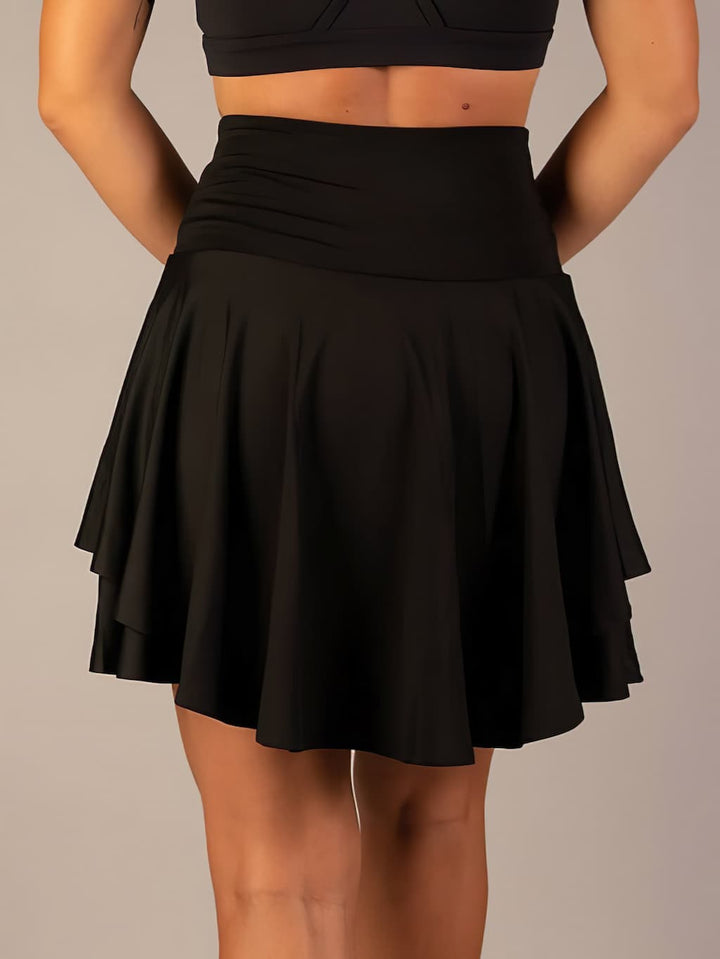 Comfortable women's active skirt with built-in shorts and practical pockets for everyday wear.