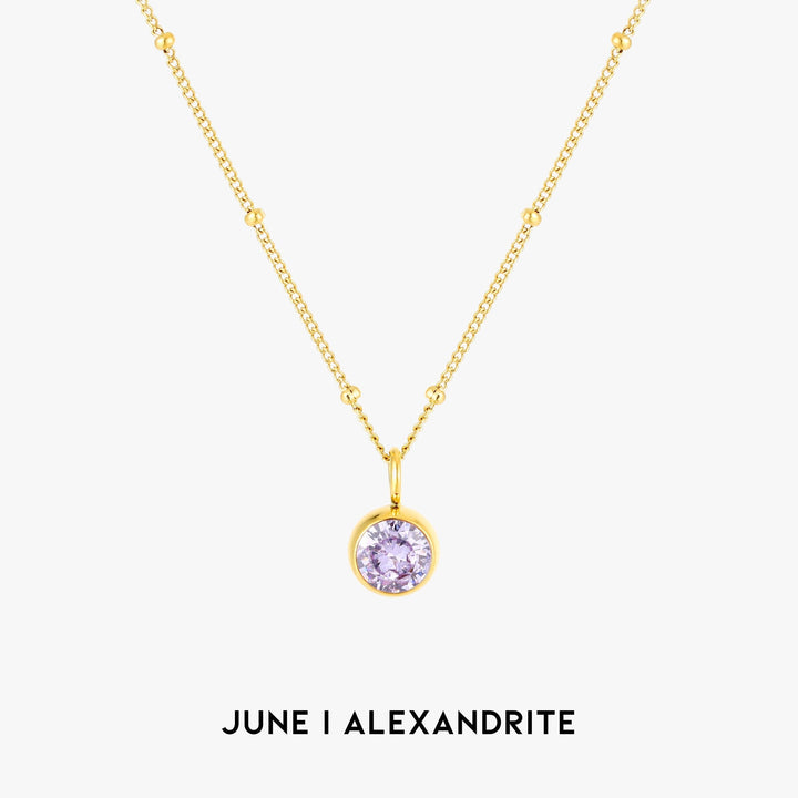 Women wearing an elegant silver Aurora birthstone necklace, custom gemstone jewelry.