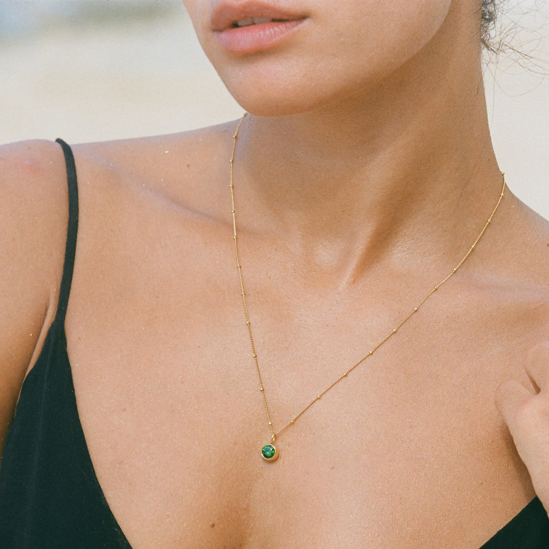 Personalized gold birthstone necklace, elegant gift for women.