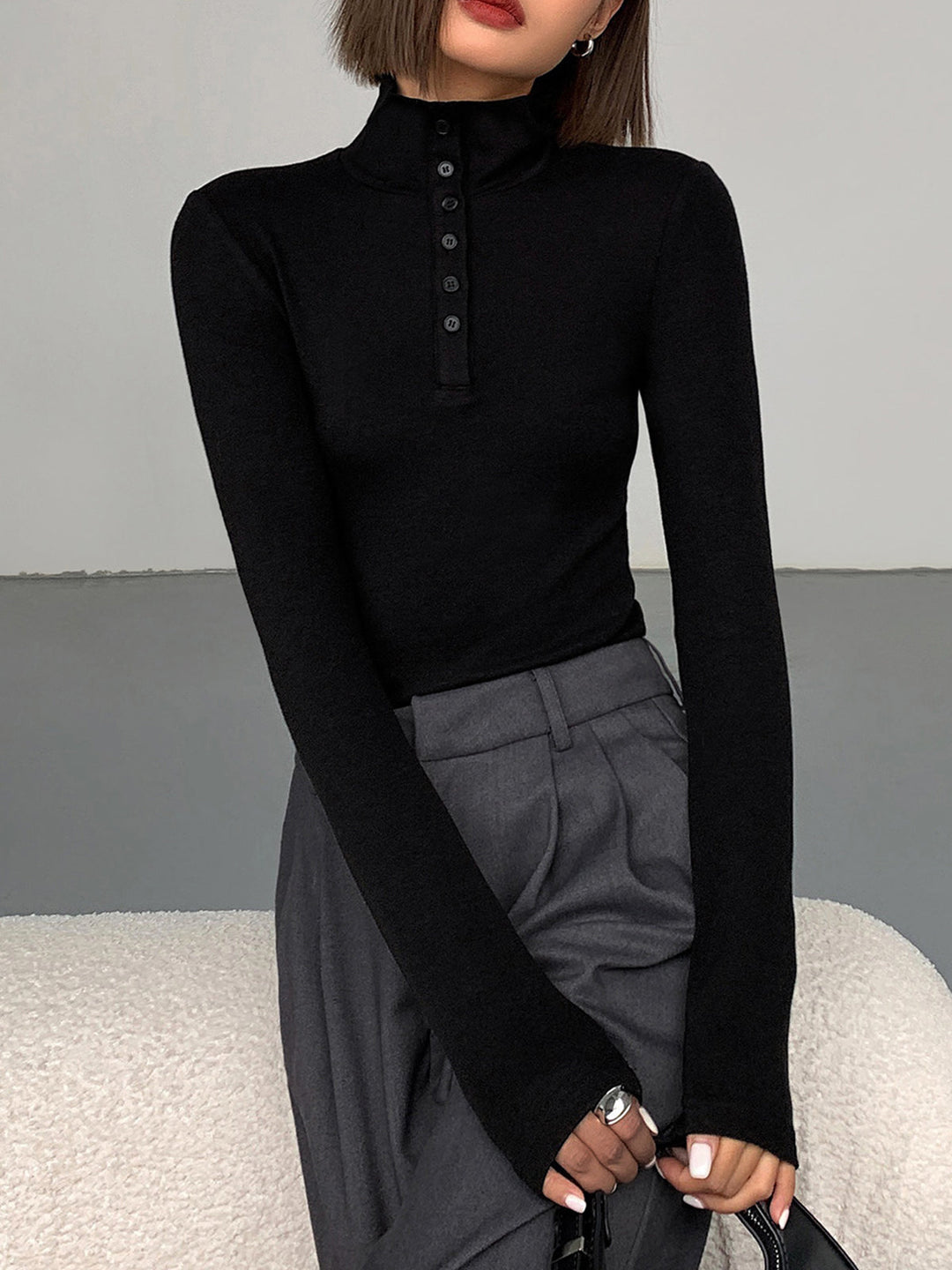 Soft rayon blend Aurora women's funnel neck jumper, long sleeve, with chic button accents for comfort and style.
