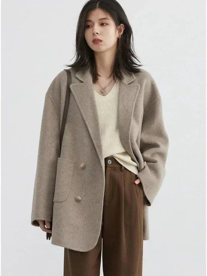 Warm & cozy women's Aurora reversible winter coat. A stylish luxury wool jacket, perfect for elegant winter fashion.