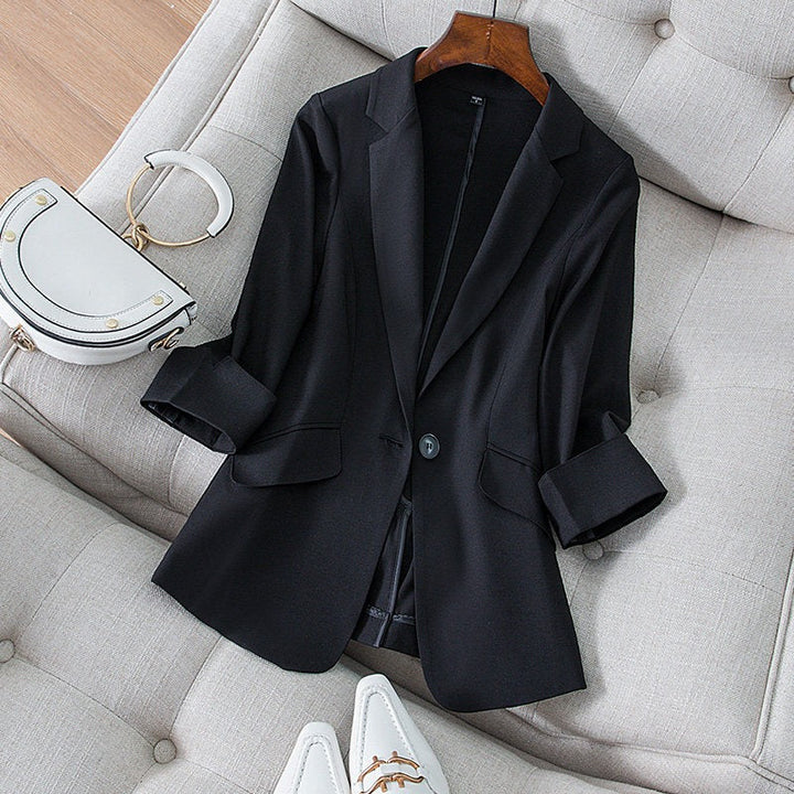 Close-up of Ava women's blazer fabric, showing its polished texture and comfortable feel. Modern layering piece.